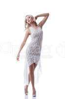 Charming young blonde posing in erotic dress