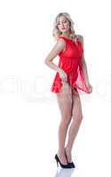 Alluring slim blonde posing in red erotic lingerie