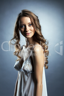 Image of pretty skinny brunette in white negligee