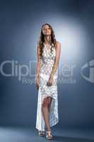 Beautiful model posing in long erotic lacy dress