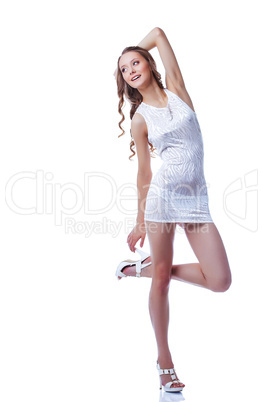 Cheerful long-haired model posing in short dress