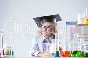 Petite blonde schoolgirl posing in laboratory
