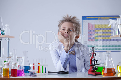 Portrait of young boy posing in laboratory