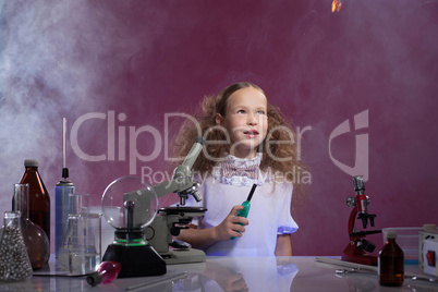 Image of pretty schoolgirl posing in chemistry lab