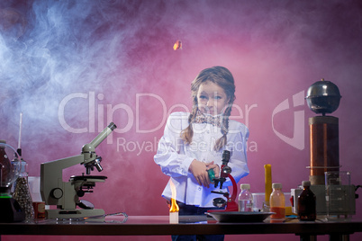 Studio shot of startled little girl in laboratory