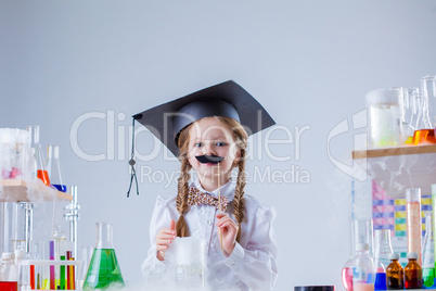 Merry little scientist posing with fake mustache
