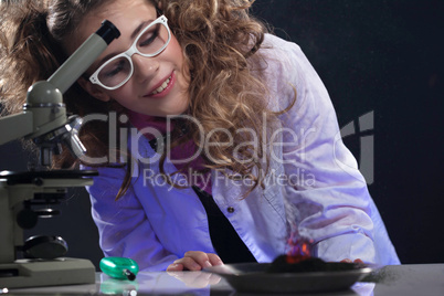 Smiling young physicist conducting experiment