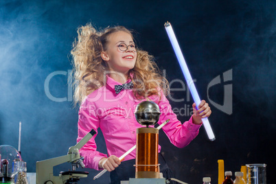 Cheerful curly girl posing in magical lab