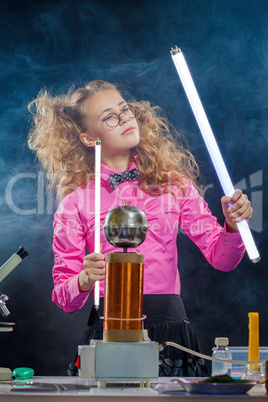 Image of ingenious girl conducting experiment