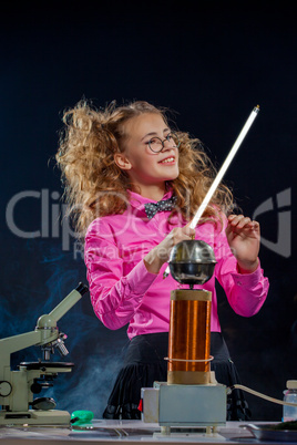 Portrait of adorable schoolgirl posing in lab