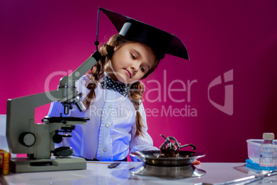 Portrait of curious girl posing in science lab