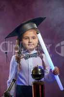 Charming little girl posing with lamp in lab