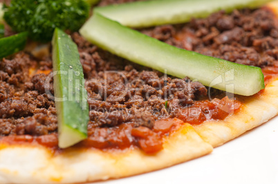 turkish beef pizza with cucumber on top