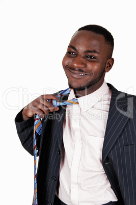 black man taking off tie.