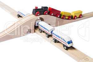 wooden toy trains on railway