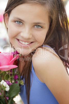 pretty young girl holding flower bouquet at the market