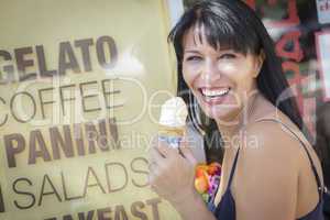pretty italian woman enjoying her gelato at the street market.