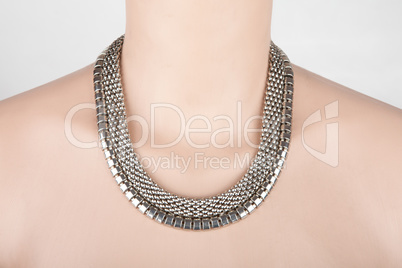 Beautiful silver statement necklace on a mannequin