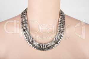 Beautiful silver statement necklace on a mannequin