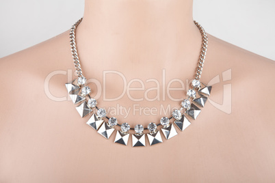 Beautiful silver statement necklace on a mannequin