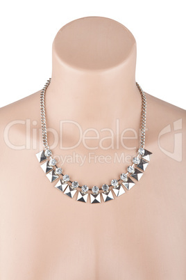 Beautiful silver statement necklace on mannequin isolated on whi