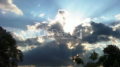 Time lapse clip of white fluffy clouds over blue sky