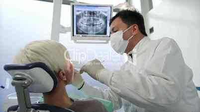 9of19 Dentist visiting patient in dental studio, oral hygiene, health