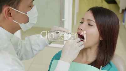 15of19 Dentist visiting patient in dental studio, oral hygiene, health