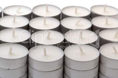 rows of white wax tea light candles