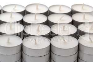 rows of white wax tea light candles