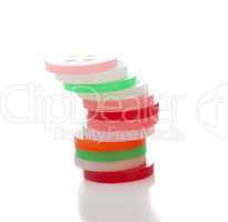 pile of plastic round tokens, on white background