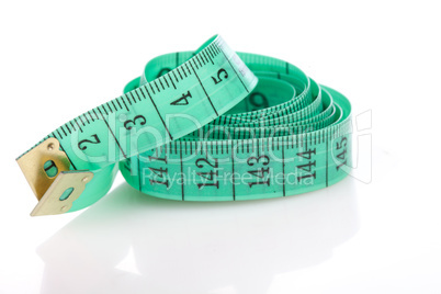 green measuring tape, symbol of accuracy, on white