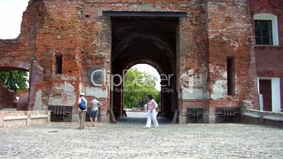 People walk along the Terespol gate at the Brest Fortress