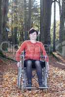 wheelchair user in autumnal park