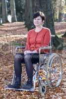 wheelchair user in autumnal park