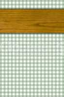 Tischdeckenmuster grau-grün weiß mit Holzbrett