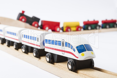 wooden toy trains on railway