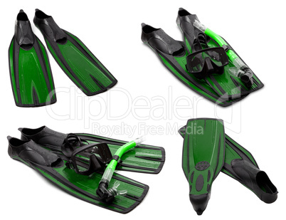 set of green flippers, mask, snorkel for diving with water drops