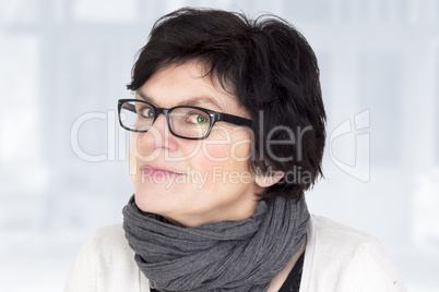 portrait of a woman with glasses in middle age