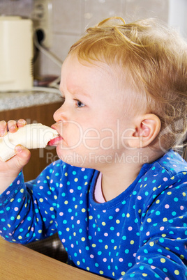 toddler eats banana