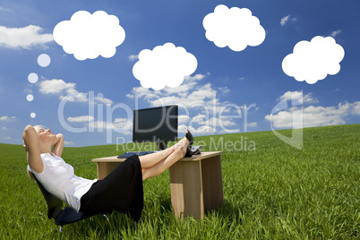 businesswoman day dreaming green field office
