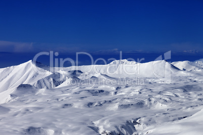 snowy plateau and blue sky