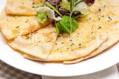 pita bread with salad on top