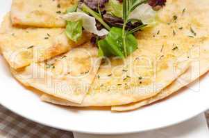 pita bread with salad on top