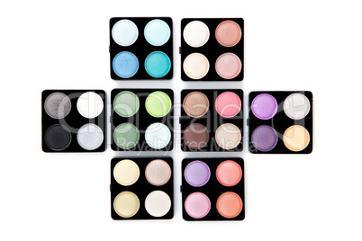 Eight eyeshadow palettes isolated on white