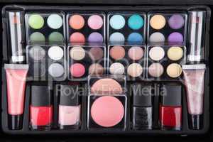 Make up case containing colorful eyeshadows, lipsticks, lip glos