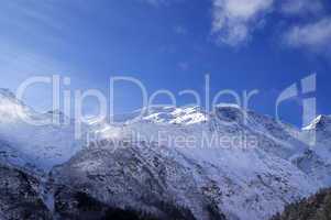 snowy sunlight mountains, view from ski slope