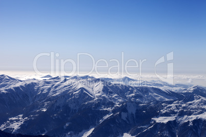 snowy mountains in haze at morning