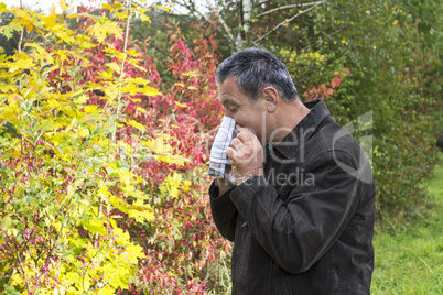 man with handkerchief in autumn