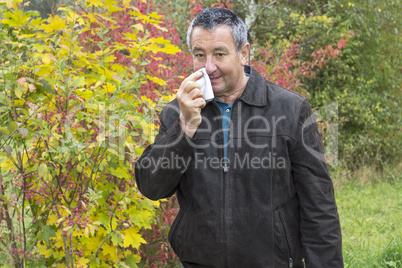 man with handkerchief in autumn